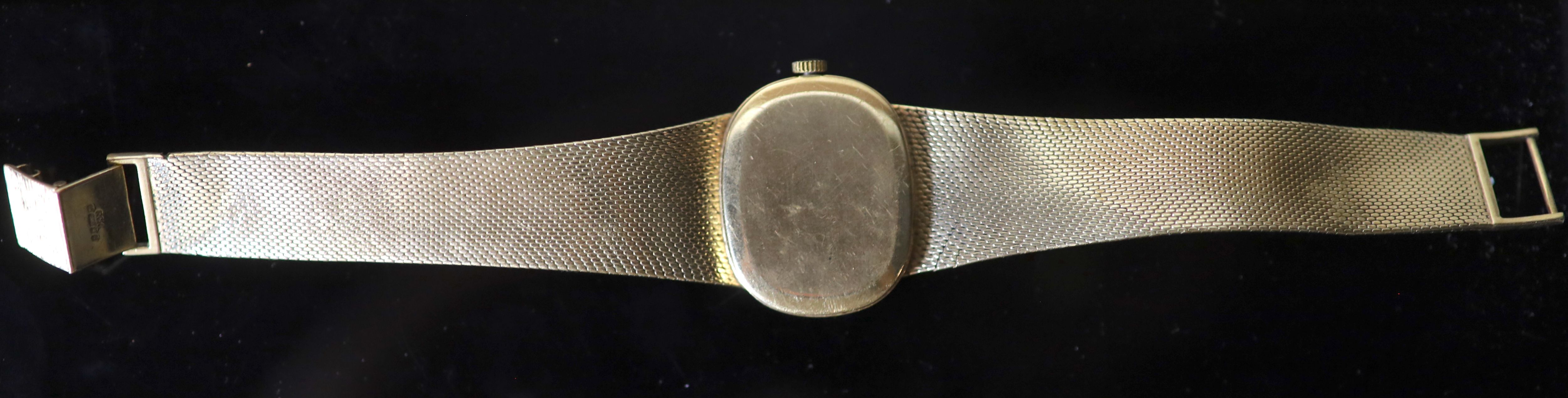 A gentlemans 1970s 9ct gold Bueche Girod manual wind dress wrist watch, on a 9ct gold bracelet,